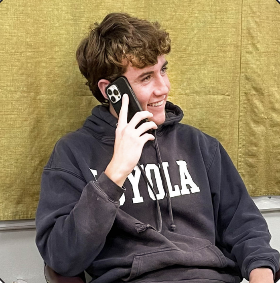 Griffin Kelly '25 Laughs While Talking To A Friend On His iPhone 13 Pro